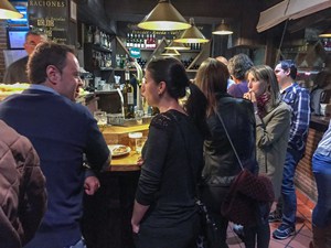 people in a crowded tapas bar