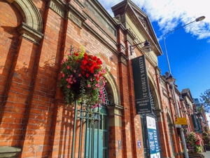 flowers on the front of St. George's Market. Visiting it is one of the best things to do in Belfast.