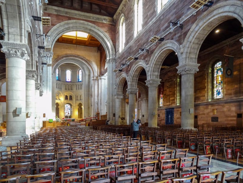 a man visiting Belfast Cathedral, one of the things to do in Belfast.