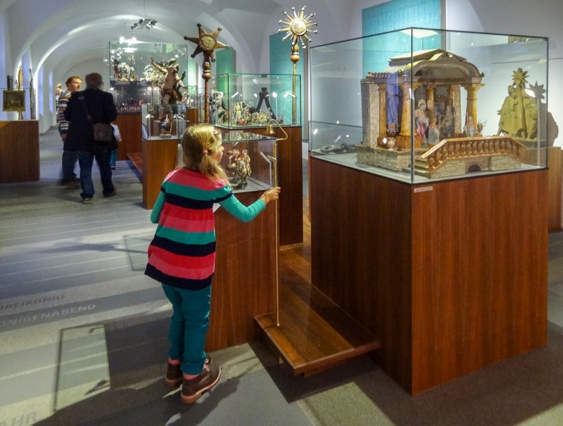 people looking at settings in a folk museum - one of the things to do in Innsbruck