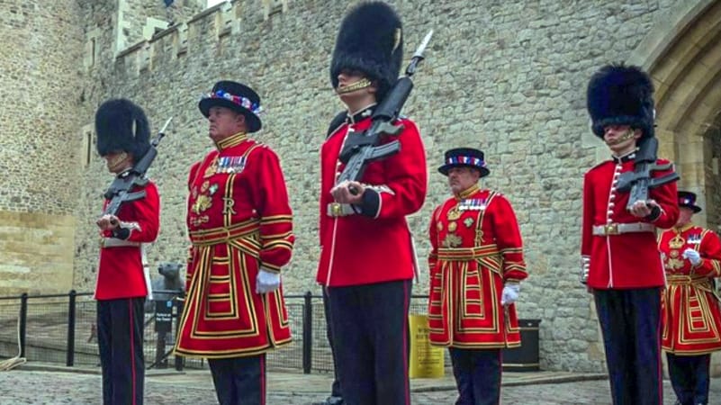 guards in red tunics at attention