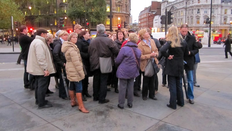 a crowd of people on a tour