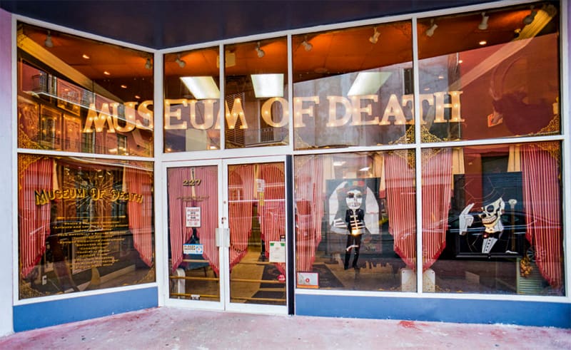 a storefront with a sign for the Museum of Death