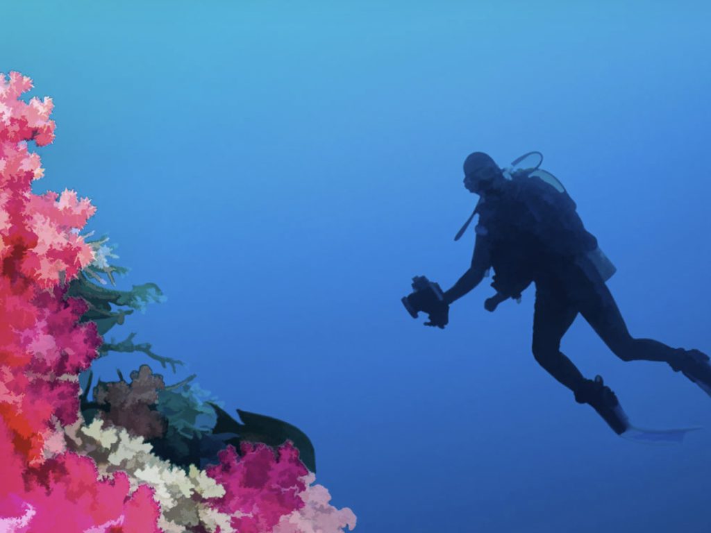 A scuba diver photographing an underwater art exhibit