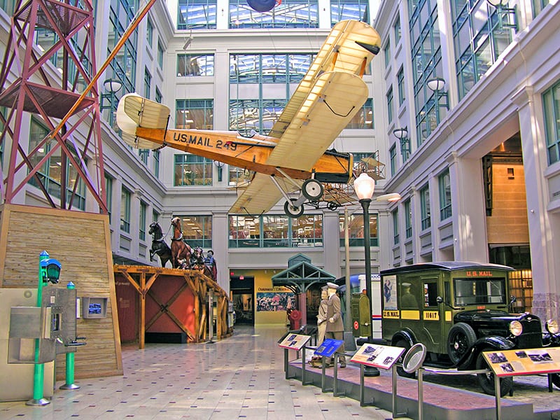 an airplane and a truck in an unusual museum