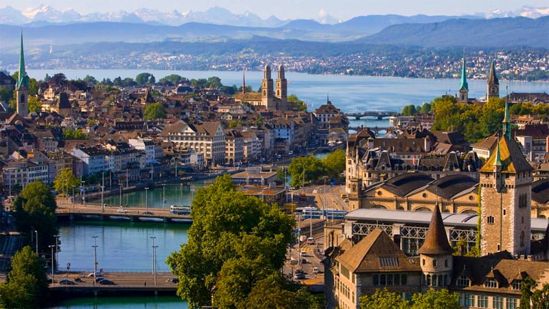 The skyline of an old city on a lake that is one of the best places in Switzerland