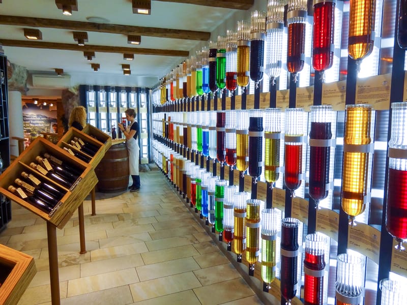 a shop with many colorful bottles on the wall