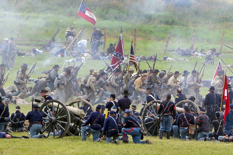 union and confederate soldiers during battle in one of the Civil war reenactments