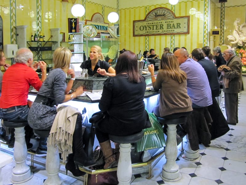 people at a counter in an oyster bar