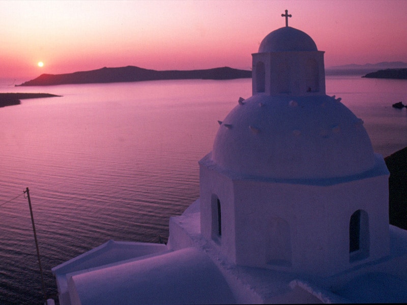 a church at sunset on one of the best Greek islands to visit