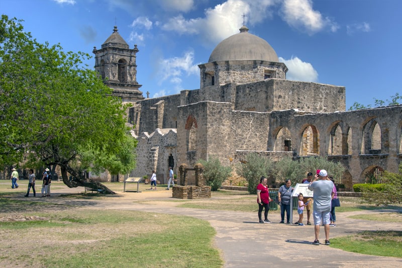 people visiting a Mission - one of the things to do in San Antonio