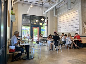 people in a large indoor cafe