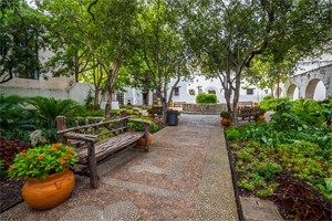 a garden with wooden benches