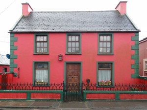A bright red house on the Dingle peninsula in Ireland