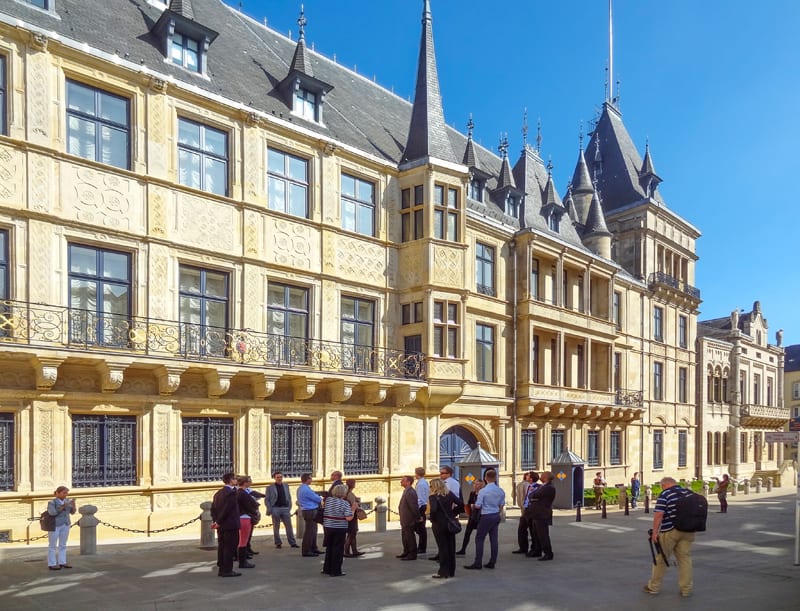 people admiring an ancient building, one of the things to do in Luxembourg