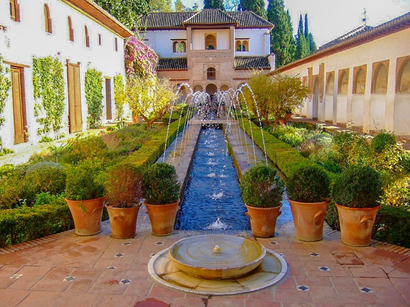 fountains streaming over a long pool