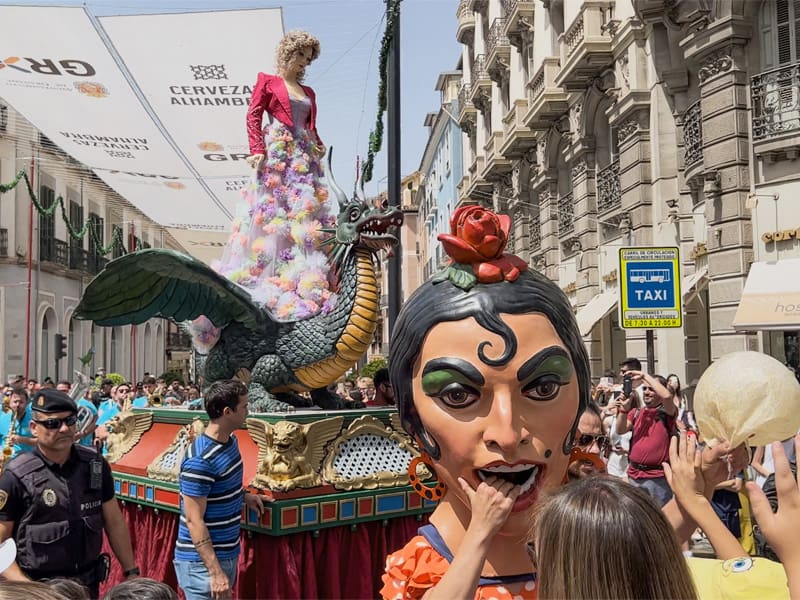 large paper maiche figures in a parade