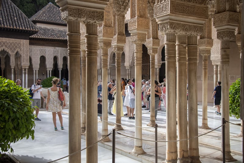 things-to-do-in-granada-people-in-alhambra-courtyard.jpg