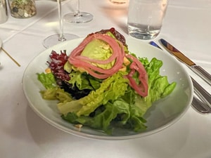 a colorful salad on a restaurant table