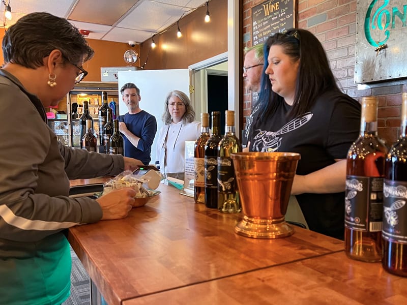 people sitting at a bar sampling mead in Seattle Southside