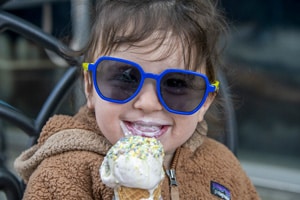 a little girl eating ice cream