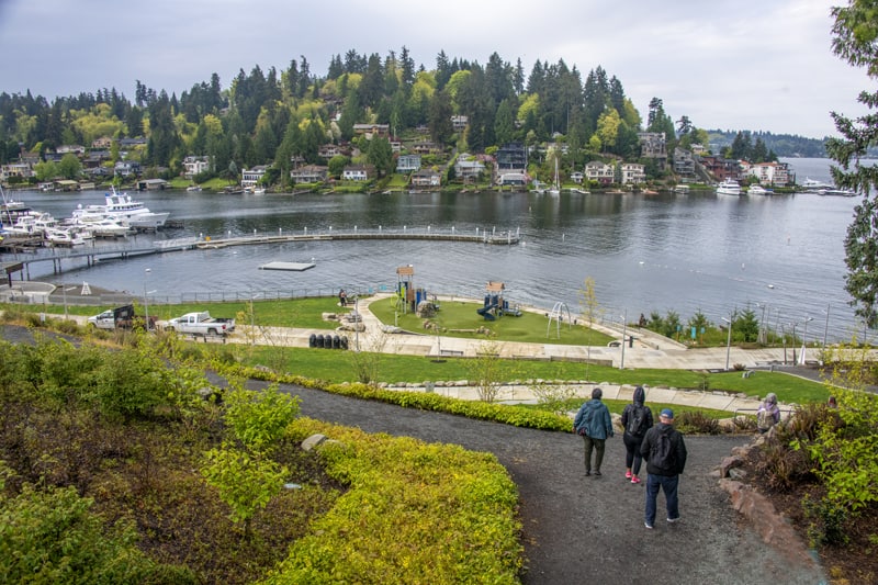 people taking a walk along a bay, one of the things to do in Bellevue