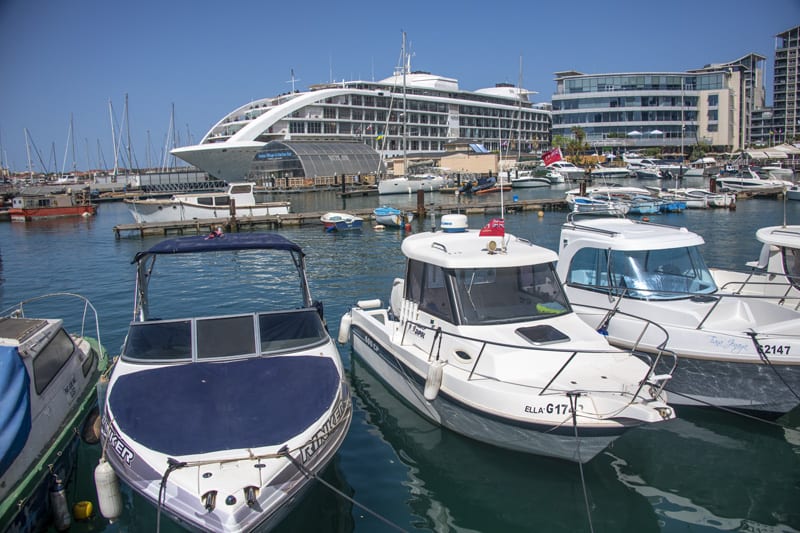 a marina with a large cruise ship  - one of the things to do in Gibraltar