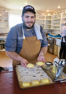 chef hand-making ravioli in a restaurant kitchen