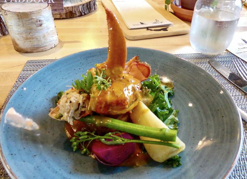 The main course of lobster on a plate at The Fireworks Feast, one of the best restaurants in pei