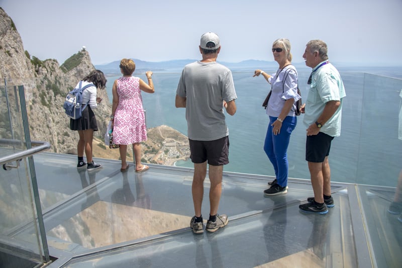 people standing on a skywalk high over the Mediterranean  - one of the things to do in Gibraltar