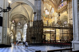 the interior of a large cathedral seen when you visit on day trips from Madrid