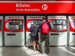 people buying train tickets to take day trips from Madrid