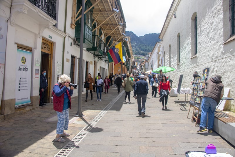 people walking through La Candelaria - what to do in Bogota