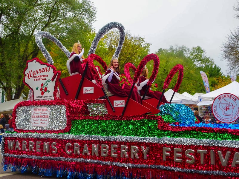 young women on a float in a parade