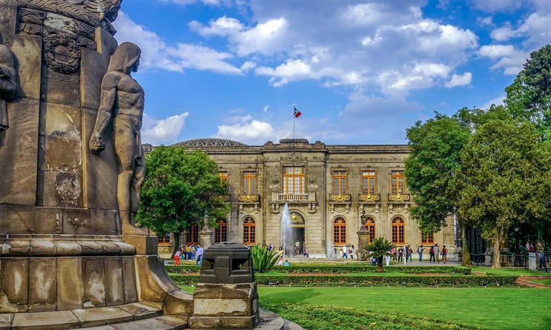 ornate statuary in front of a castle - one of the places to visit in Mexico City