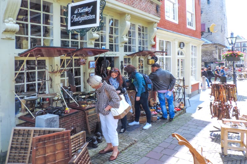 people at an antique shop during day trips from Amsterdam