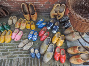 old, colorful wooden shoes in an antique shop visited during day trips from Amsterdam