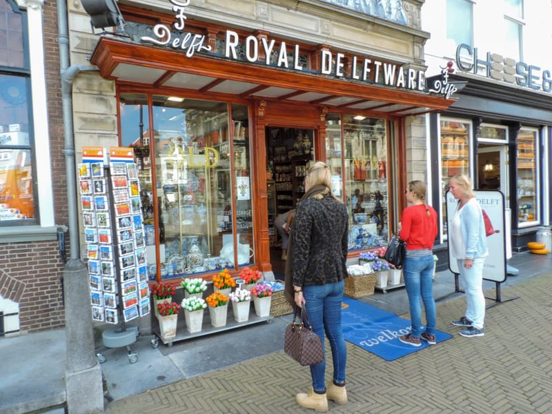 people at a Royal Delftware shop visiting during day trips from Amsterdam