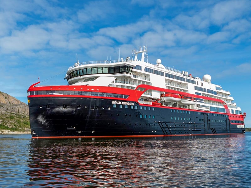 a red, black and white cruise ship - the Ms Roald Amundsen