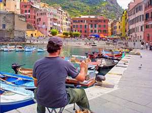 a artists painting a view of a colorful harbor