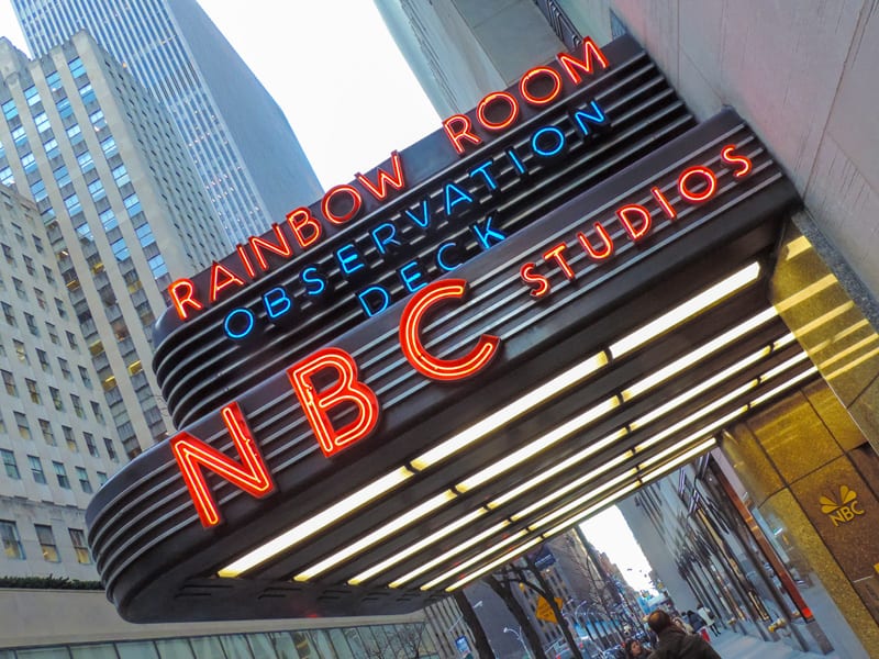 a sign for NBC Studios and the Rainbow Room in New York in winter