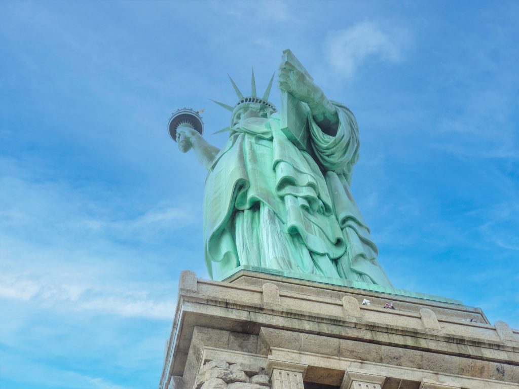 looking up at the Statue of Liberty from below its pedestal