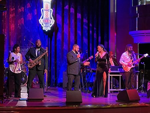 performers in a blue's club on the ship