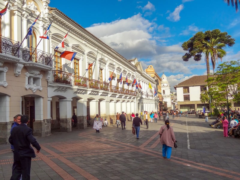 a large plaza with Spanish colonial buildings in Quito, one of the places to visit in Ecuador