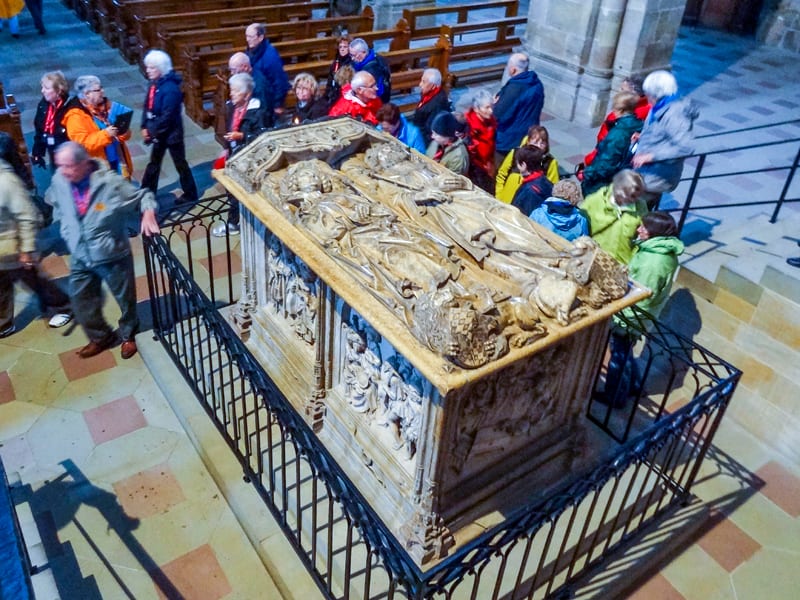 people walking by a crypt in an old cathedral – one of the things to do in Bamberg, Germany