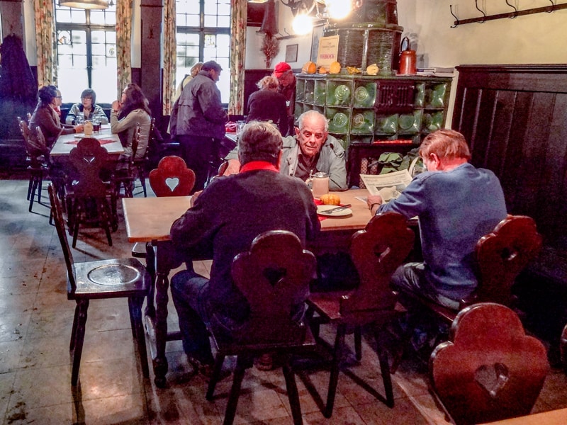 men sitting at a table in a restaurant