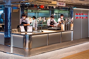 servers preparing hamburgers in a restaurant aboard the Rotterdam