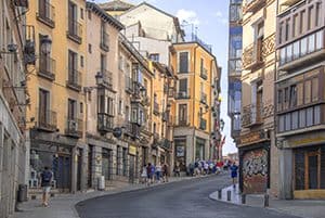 a street with colorfully painted buildings seen on a Toledo from Madrid day trip