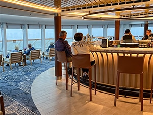 people sitting a bar talking on an expedition in Antarctica