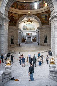 people inside the rotunda of a state capital